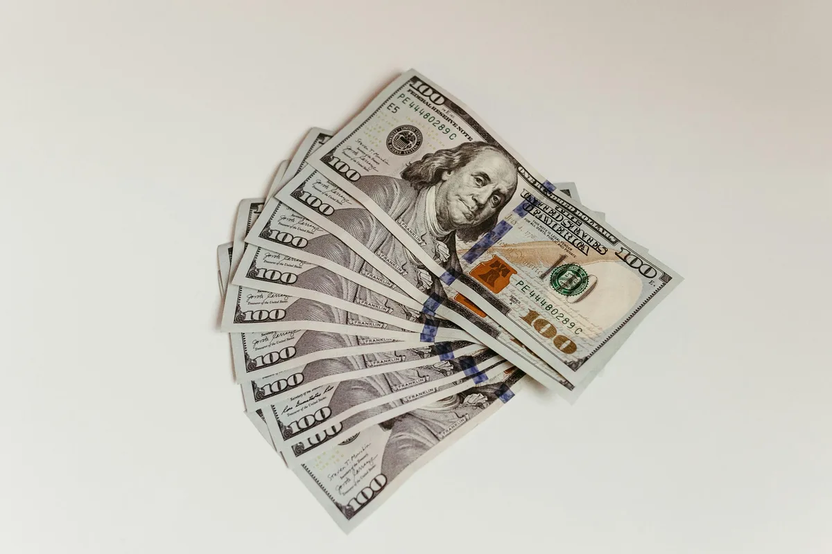 Fan of hundred dollar bills — illustrating FineDay Funds loan amounts up to $5,000